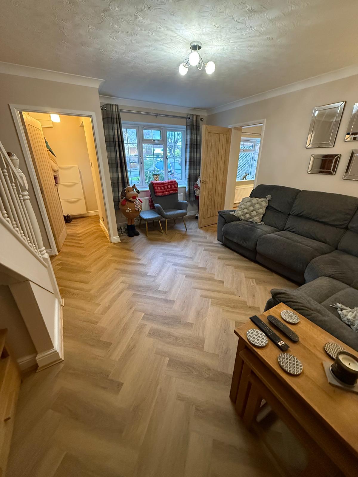 Herringbone LVT flooring laid in a living room